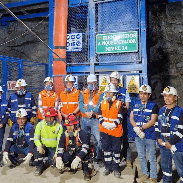 Miners at a newly commissioned mine elevator in Peru